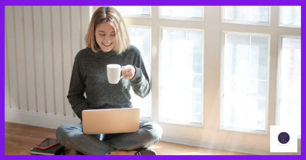 Woman with a cup of coffee checking her email marketing on a laptop.