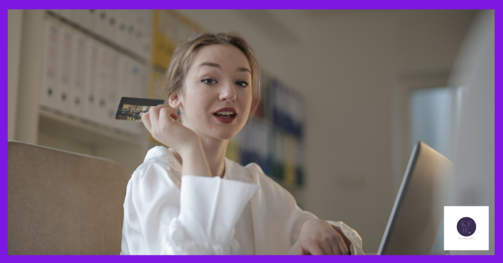 Spend money in your business - image shows woman at laptop with credit card.