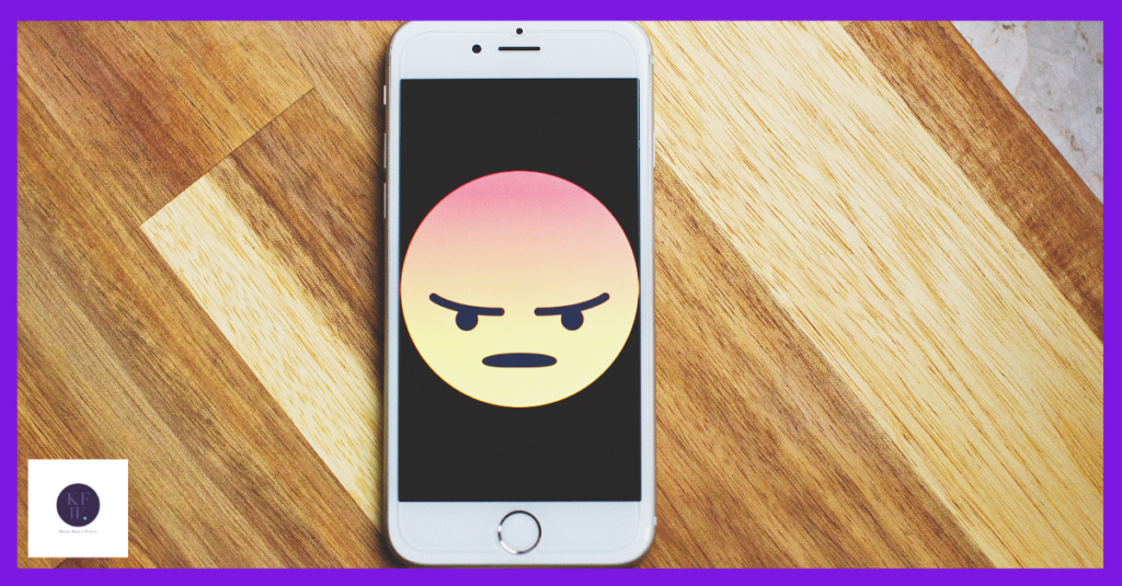A phone shows an angry emoji. I try to understand why you would focus on the people who hate you,